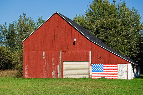 American flag on red barn