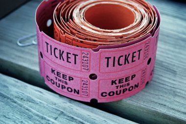 Roll of pink raffle tickets clipart