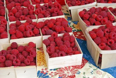 Raspberries at the market clipart