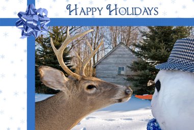 Deer with Christmas snowman clipart