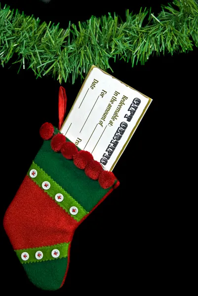 Gift certificate in Christmas stocking — Stock Photo, Image