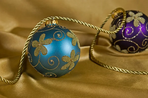 Fancy ornaments on satin — Stock Photo, Image