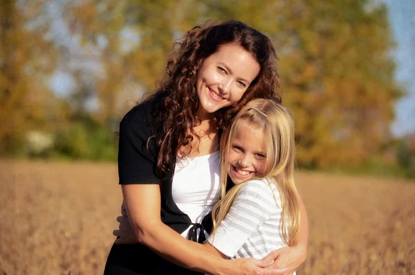 stock image Mother hugging daughter