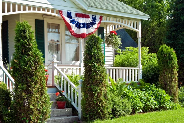 Flag bunting on house — Stock Photo, Image