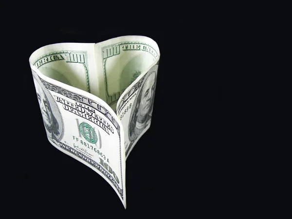 stock image Heart shaped hundred dollar bill