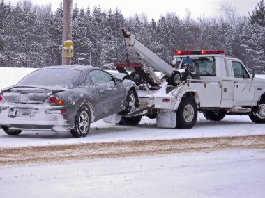 Tow truck towing a wrecked car clipart