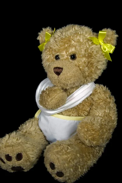 Teddy bear in een sling — Stockfoto