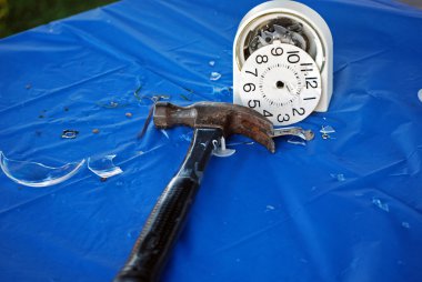 Hammer with smashed alarm clock clipart