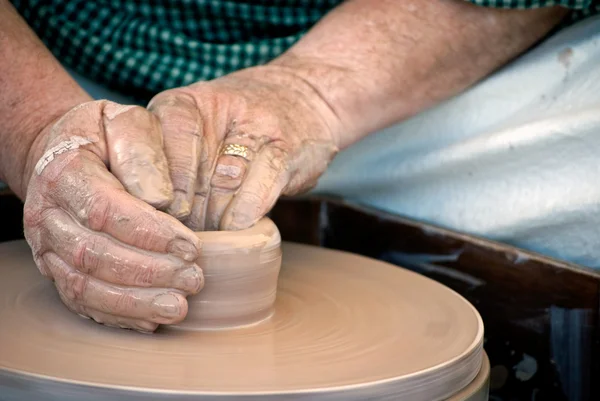stock image Potter making a vase on wheel