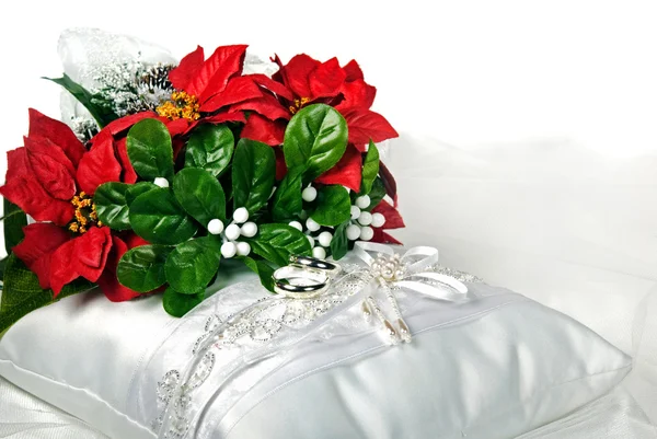 Poinsettia bouquet on bridal pillow — Stock Photo, Image