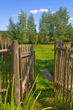 Wooden gate to the garden clipart