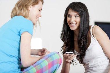 Two friends exchanging texts clipart