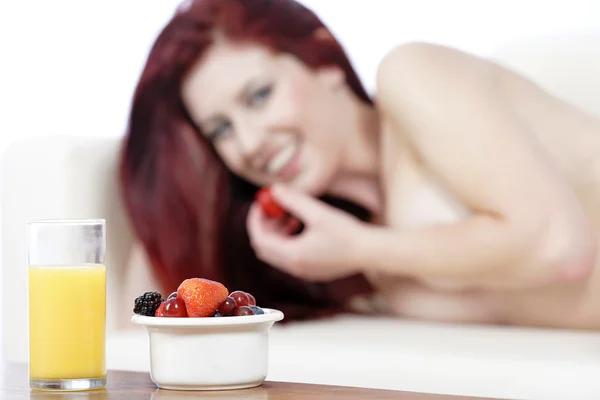 Fresh breakfast with woman in background — Stock Photo, Image