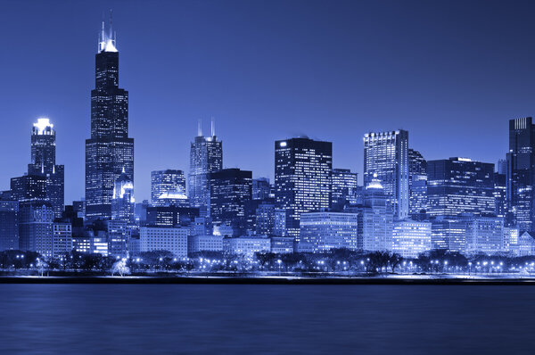 Toned image of the Chicago skyline at night.