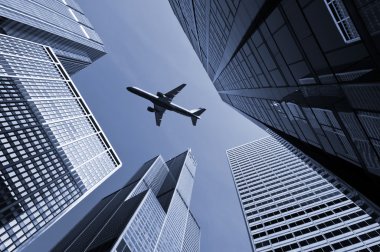 Airplane above city of Chicago. clipart