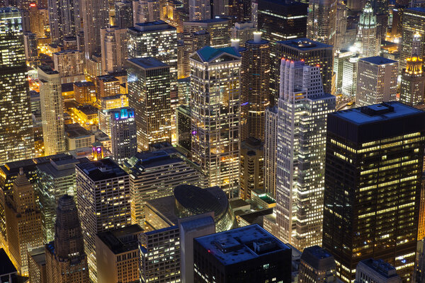 Close up image of Chicago downtown buildings at night.