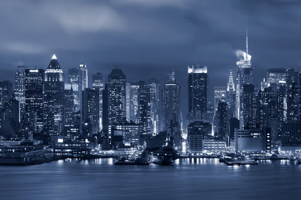 Toned image of the Manhattan skyline viewed from New Jersey at night.