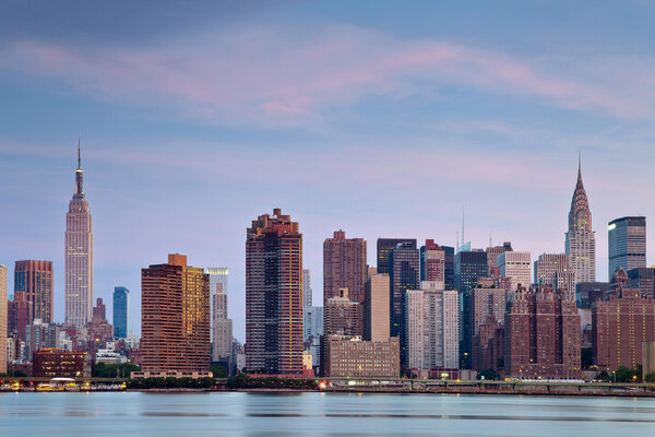 Manhattan skyline viewed from Queens at twilight.