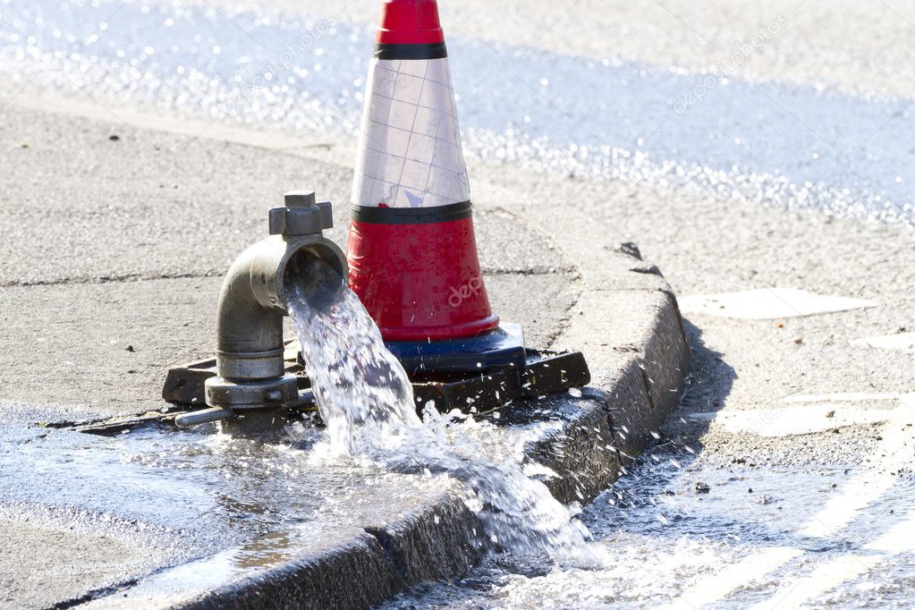 Water being released while a water main is repaired