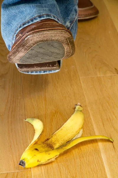 Stock image Foot about to tread on a banana skin