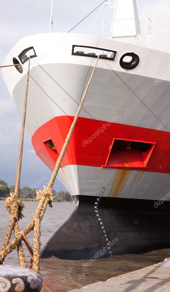Moored ship bow showing loading guage and anchor