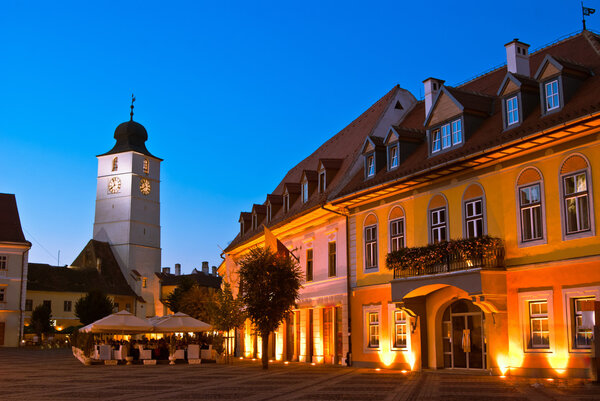 Main square and council tower in sibiu, romania at blue hour