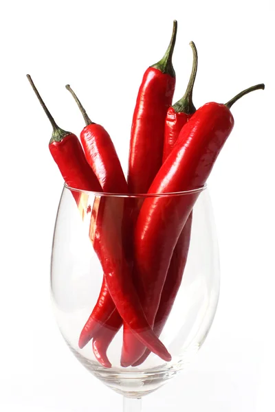 Bunch of red chili peppers in a glass — Stock Photo, Image