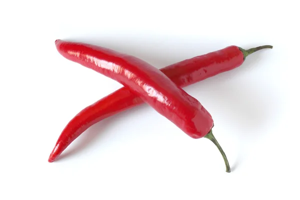 Two crossed red chili peppers — Stock Photo, Image