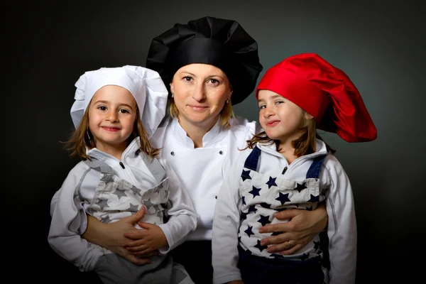 Family cook chef with kitchen hats — Stock Photo, Image