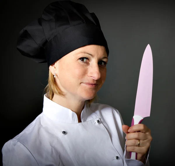 Kuchař kuchař žena s kuchyňským nožem — Stock fotografie
