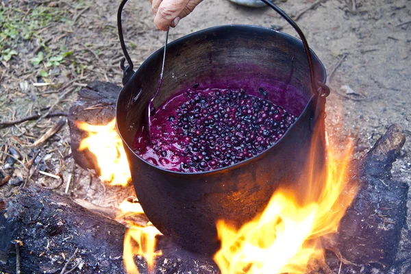 Stock image Cauldron with jam of the forest berries