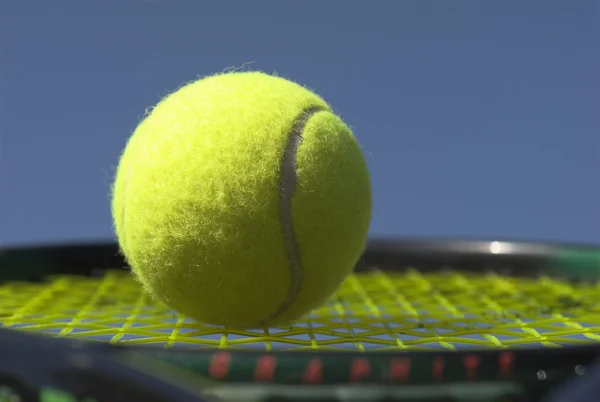 Ball on racket — Stock Photo, Image