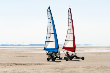 Land sailing on the beach clipart