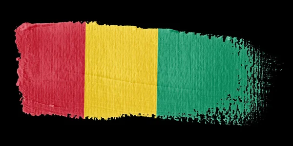 ブラシ ストロークの旗のギニア — ストック写真