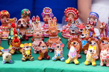 Ethnic painted toys made of clay clipart