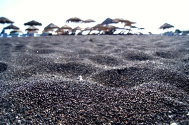 Black beach on the island Santarin clipart