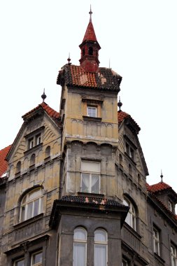 Old house with a turret in winter Prague clipart