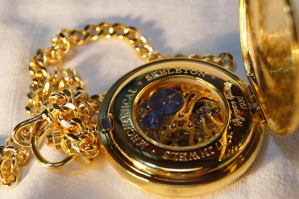 Gold pocket watch with chain — Stock Photo, Image