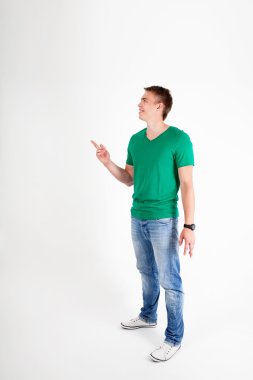 Casual man pointing something abowe clipart