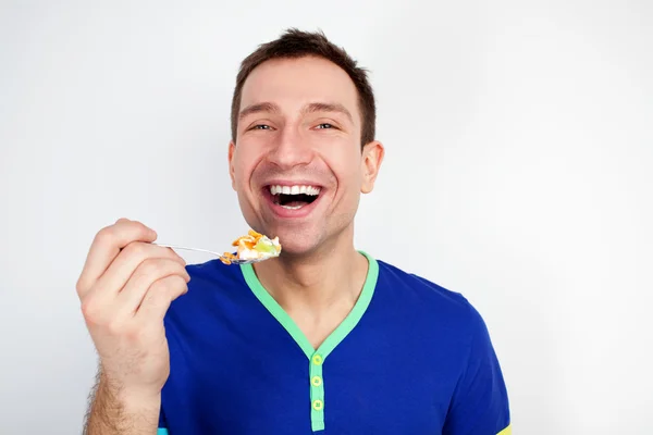Young man eat yogurt — Stock Photo, Image