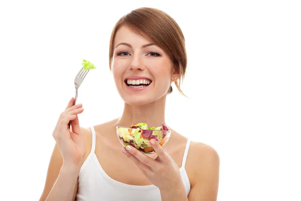 Frau mit Salat auf Gabel, isoliert — Stockfoto