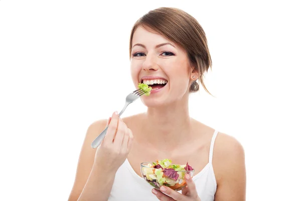 Kobieta jedzenie na białym tle sałatka — Zdjęcie stockowe