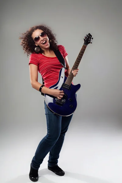 Female rockstar playing on guitar — Stock Photo, Image