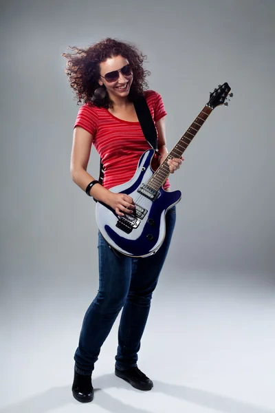 Female rockstar playing on guitar — Stock Photo, Image