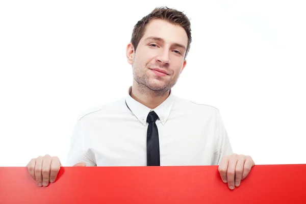 Glad affärsman med blank röd skylt — Stockfoto