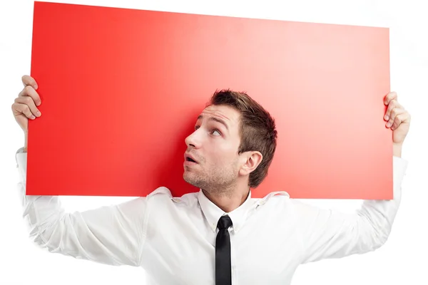 Surprised businessman with red billboard — Stock Photo, Image