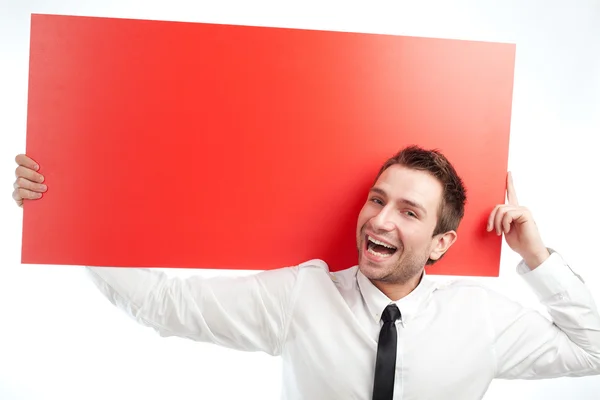 Businessman with red billboard screaming — Stock Photo, Image