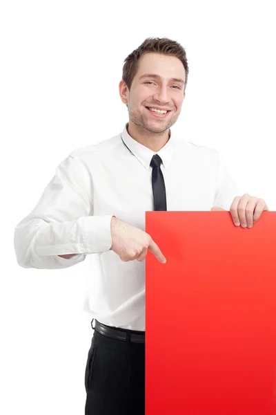 Молодой бизнесмен с красной пустой вывеской улыбается — стоковое фото