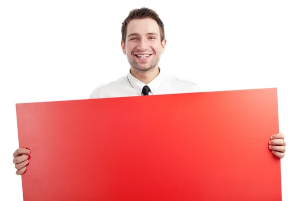 Молодой бизнесмен с красной пустой вывеской улыбается — стоковое фото