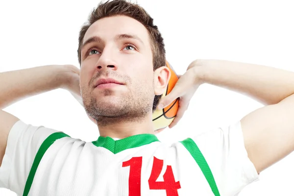 stock image Basketball player standing with ball behind his head looking up.